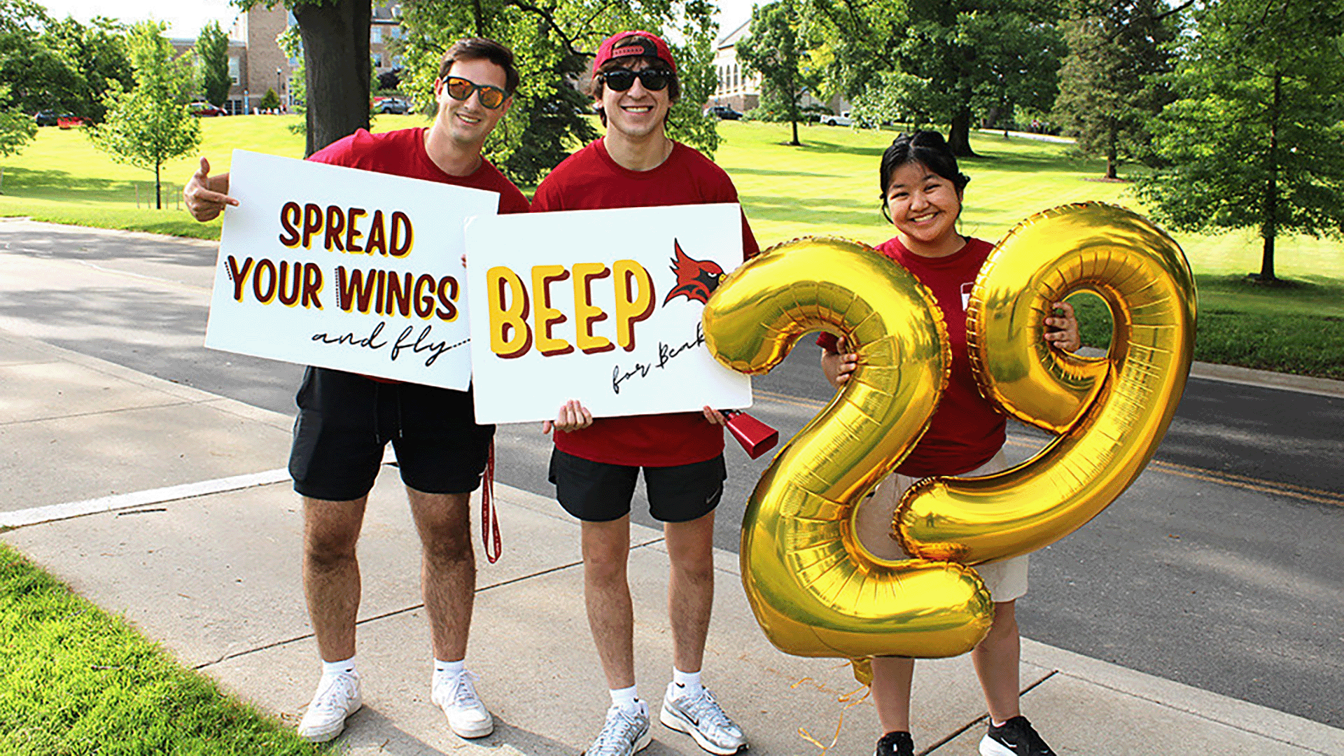 Students welcome the class of 2029 to campus with signs and balloons.
