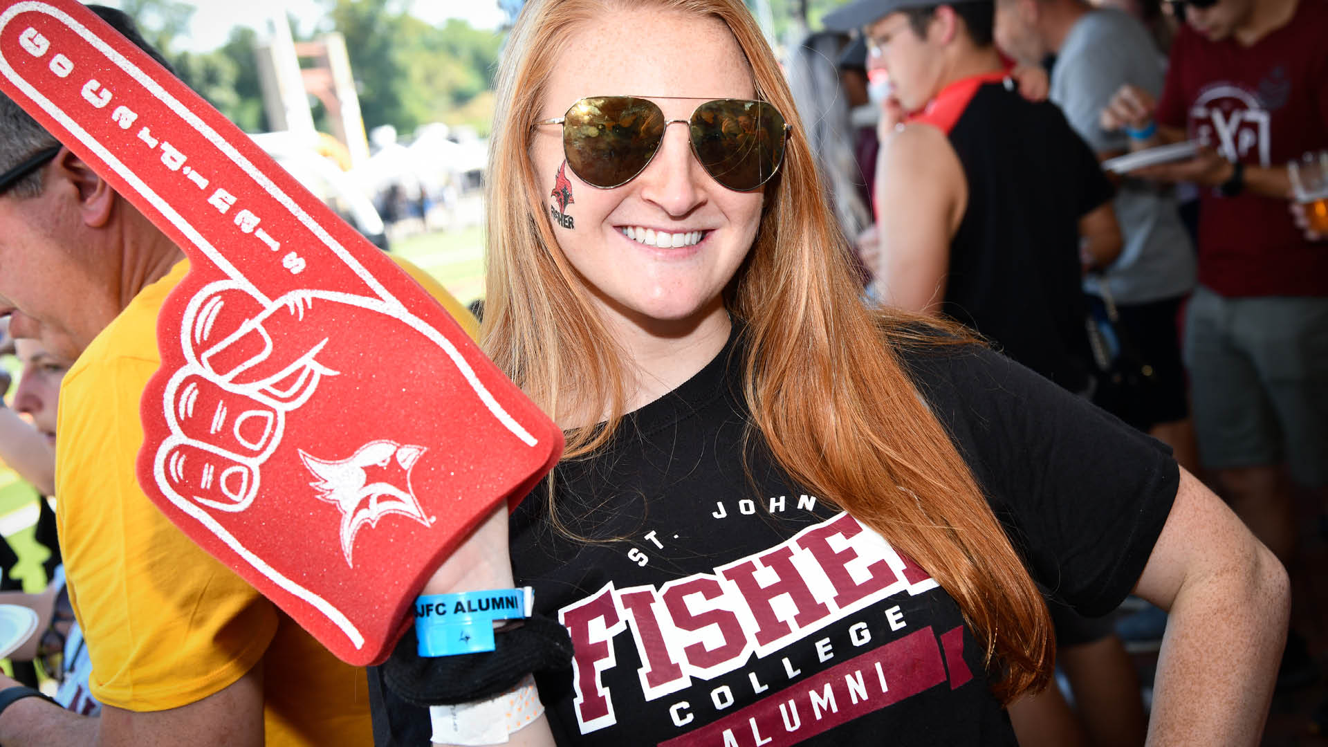 Alumna cheers on Fisher with a No. 1 foam finger