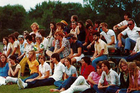 A group of students relaxing outside at Fisher in 1975