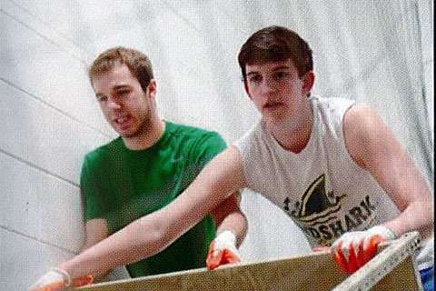 2015 two students helping with a community service project