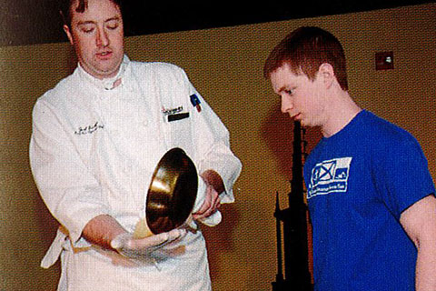 2015 student with Joel Kraft at a cooking demonstration