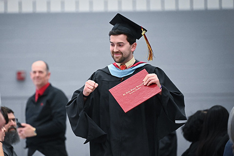 A Double Cardinal celebrates his graduate degree.