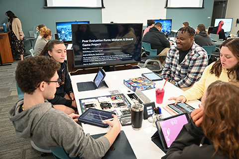 Students use iPads during a class activity.
