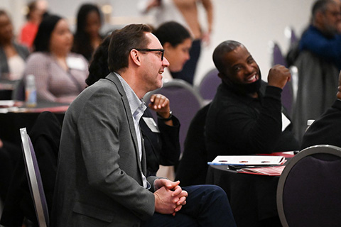 Conference attendees participate in discussion.