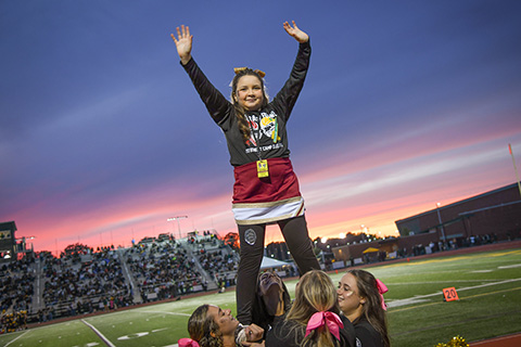 Cheering at the Courage Bowl to benefit Camp Good Days and Special Times.