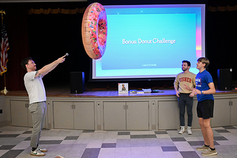 Families participate in Twisted Trivia during Fisher Family Weekend.