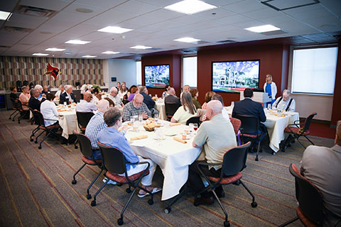 Special event at Skalny Welcome Center with several people seated at tables.