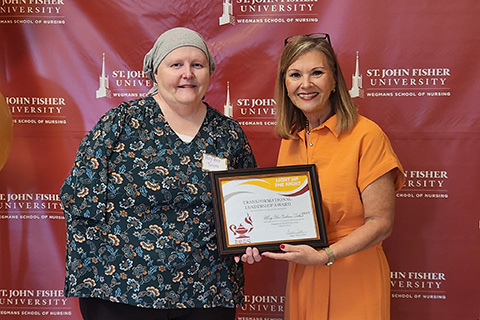 Mary Alice Terboss receives an award at the annual nursing celebration.