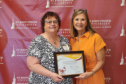 Maureen Krenzer receives an award at the annual nursing celebration.