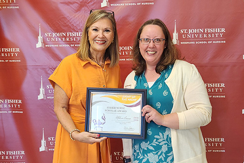 Melissa Bourne receives an award at the annual nursing celebration.