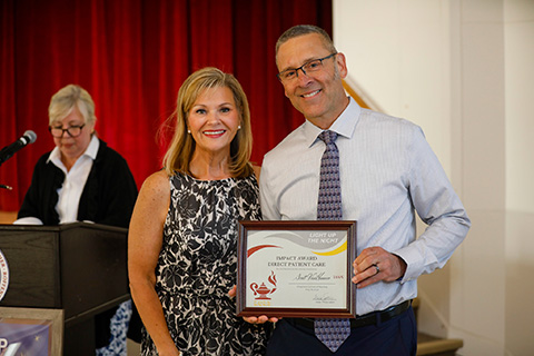 Scott VanHoover receives Fisher Nurse Impact Award.