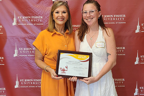 Stephanie McBride receives an award at the annual nursing celebration.