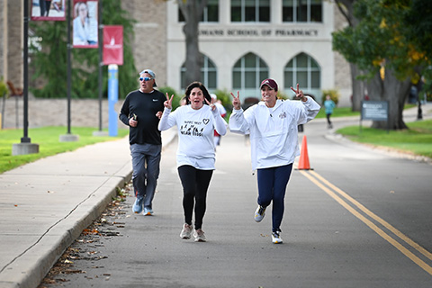 Friends and family participate in the Teddi Trot at St. John Fisher University.