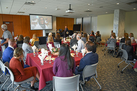 Special event in Elaine P. Wilson Formal room with people seated at tables.