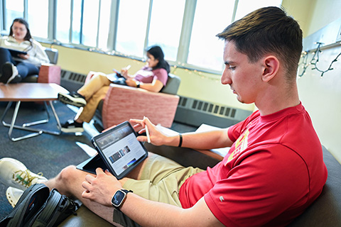 A student views news on his iPad.