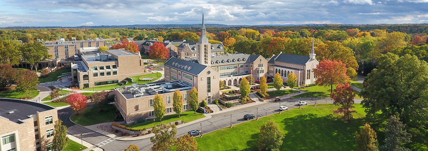 Aerial view of St. John Fisher University campus in fall with Kearney Hall prominent.