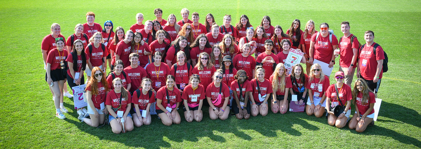 The Orientation Team gathers in preparation for new student orientation pictured with the Cardinal mascot.