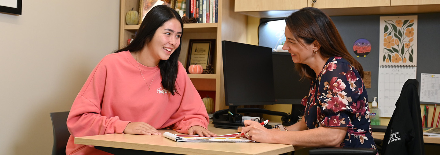 A student meets with an advisor.