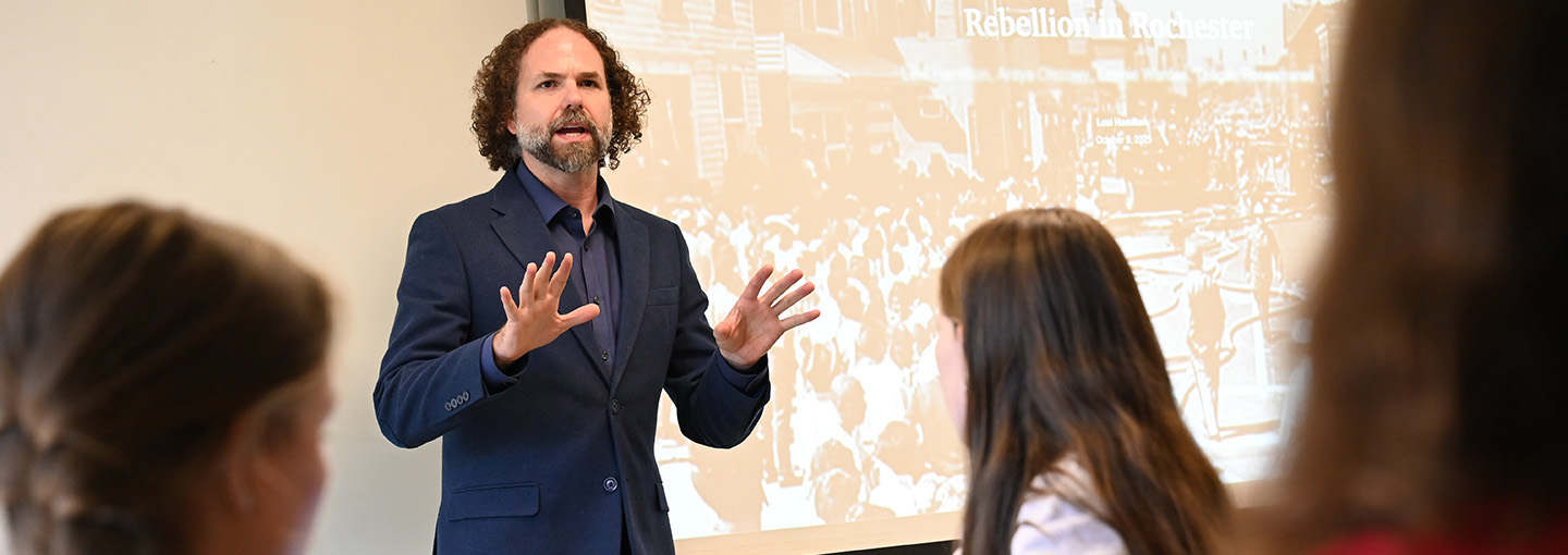 A professor teaches a history class at St. John Fisher University.