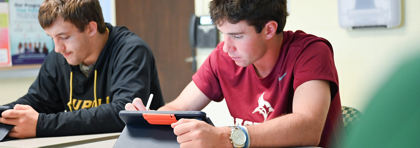 Students use their iPads for notes during class.