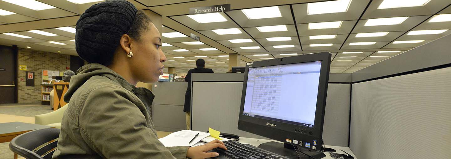 Student at computer in library