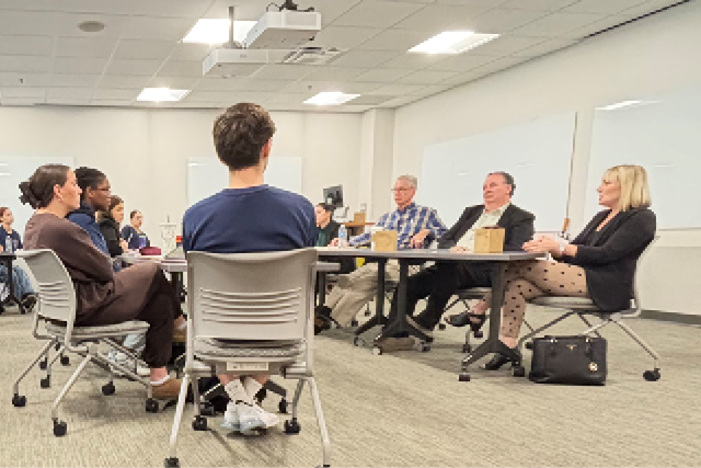 room with several people having a discussion