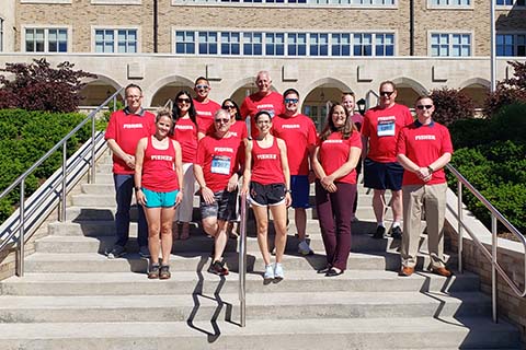The Fisher team for the Corporate Challenge in front of Kearney Hall.