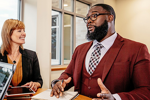 MBA students work together on a management project.
