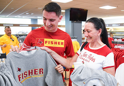 Fisher sweatshirts folded at the Cardinal Shop (University Bookstore).