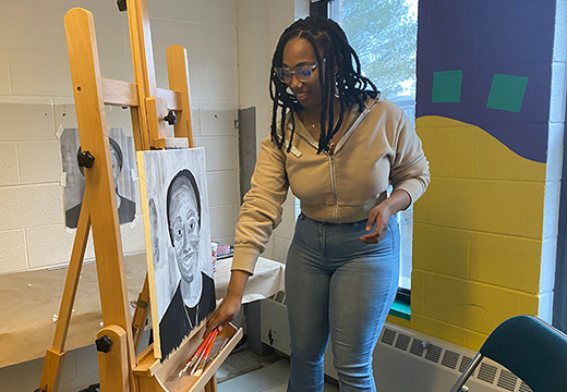 Student painting in the art studio.