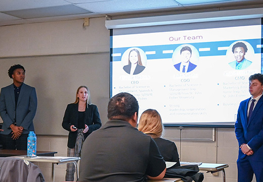 Students presenting in front of a class.