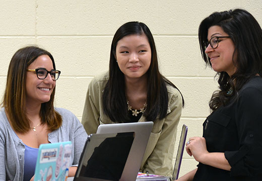 Dr. Roselle talking with students