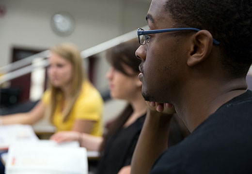 Side view of student face in classroom.