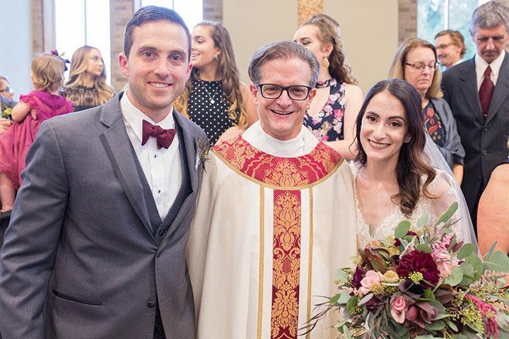 Everything about our experience perfectly embodies what it means to be a part of the St. John Fisher College family. -David '13 and Caitlin '15 Van Gorder with Father Mannara
