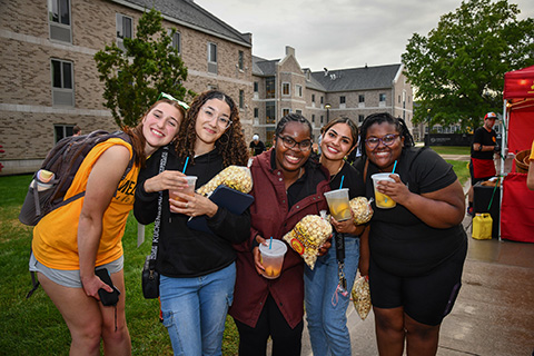 Students enjoy treats from food trucks on campus during Welcome Weekend.