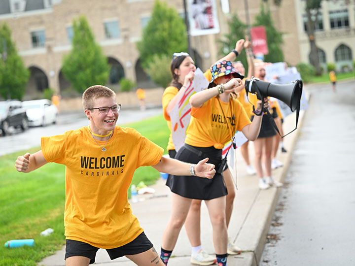 Students cheering on Fisher campus during Welcome Weekend.